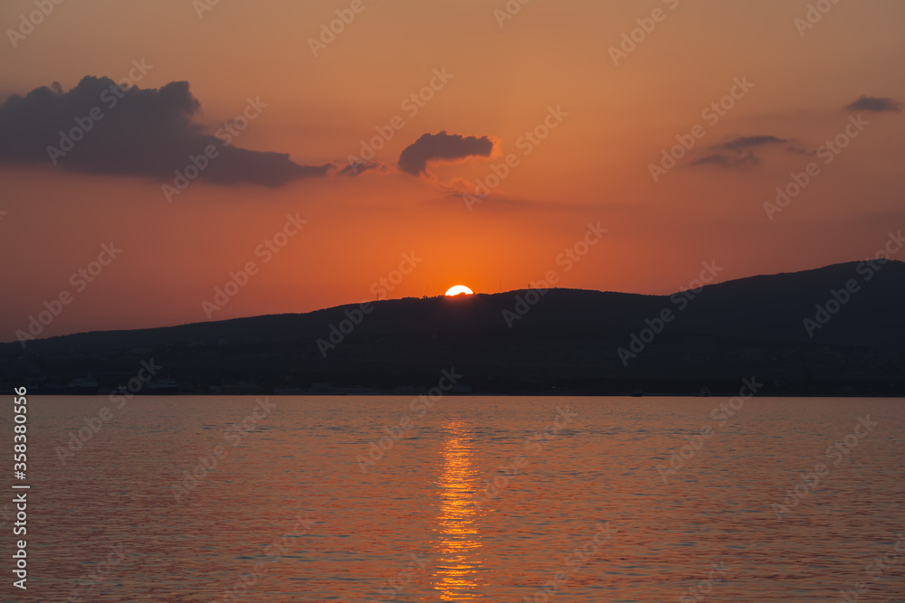 Naklejka premium Sunset over the sea. Sunset at sea. Sea Waves. Ocean waves. Black Sea, Gelendzhik.