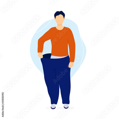 Slim man pulling his oversized pants.