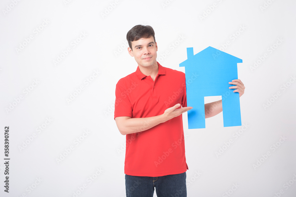 Portrait of handsome man is holding paper home on white background Portrait of handsome man is holding paper home on white background