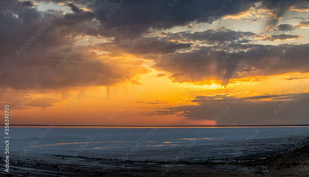 Elton Salt Lake at sunset with beautiful clouds and warm sunny color.