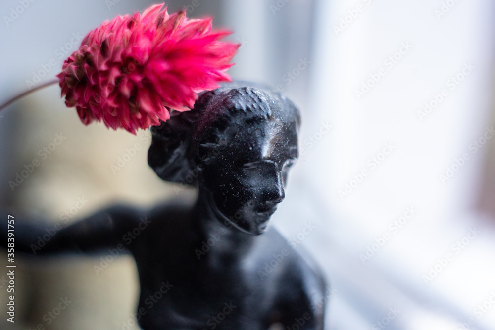 Fototapeta premium White chrysanthemum in a blue vase on a turquoise background