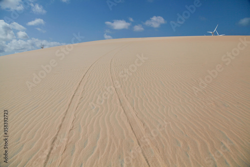  car trail on sand dune at Canoa Quebrada beach  Ceara  Brazil