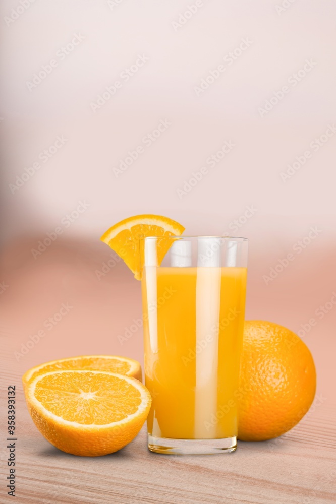 Orange juice in glass and slices of orange fruit Orange juice in glass and slices of orange fruit