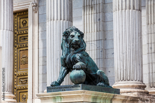 Lion statue at the Palacio de las Cortes building in Madrid house of  the Spanish Congress of Deputies built by Narciso Pascual Colomer from 1843 to 1850 in the neoclassic style