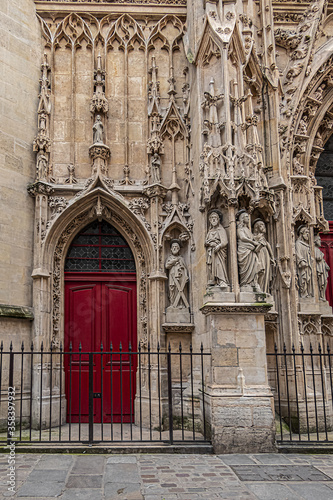 Fragment of Paris Gothic style Church of Saint-Merri (Eglise Saint-Merry, XVI) at street Rue Saint Martin. Paris, France.