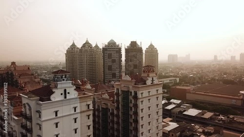 Aerial shot sunset over the city of jakarta. Mall of indonesia
