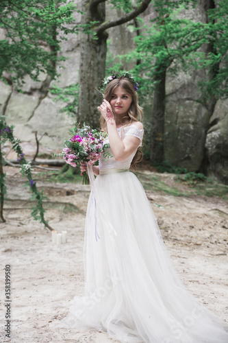 Beautiful sexy bride in white dress weeps. tears of happiness on the wedding day.