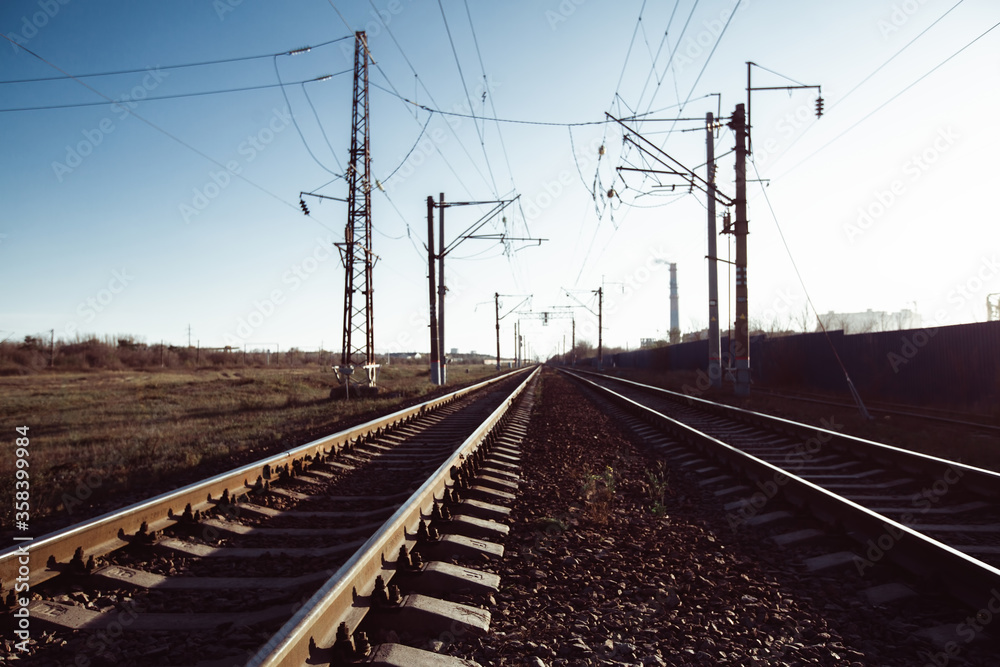 Railway tracks and electric lines in the industrial zone.