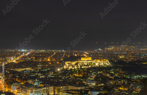 Acropolis of Athens at night with street illumination view from Filothei Hill