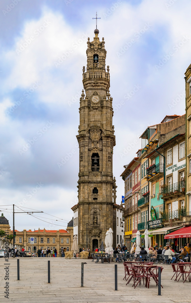 Torre dos Clerigos church bell tower and outdoor cafes in traditional houses with ornate azulejo tiles in Porto Portugal