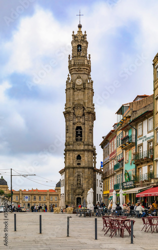 Torre dos Clerigos church bell tower and outdoor cafes in traditional houses with ornate azulejo tiles in Porto Portugal