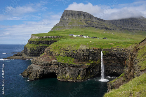 Village of Gasaladur and waterfall into the sea, Vagar Island, Faroe Islands