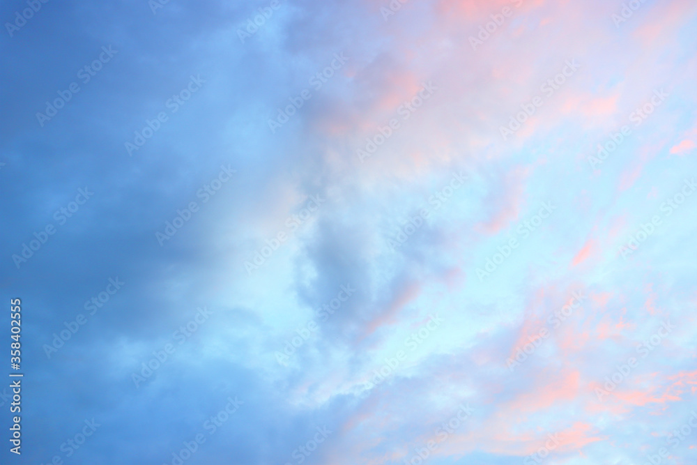 Sky before sunset, blue and pink clouds. Background image of nature.