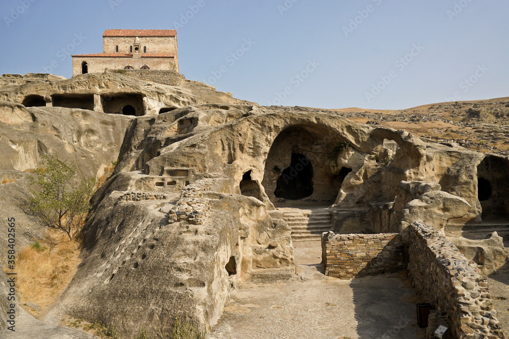 Fototapeta premium Uplistsulis Eklesia (Prince's Church) sits on a hill overlooking the ruins of the ancient monastic cave city of Uplistsikhe, near Gori, Georgia