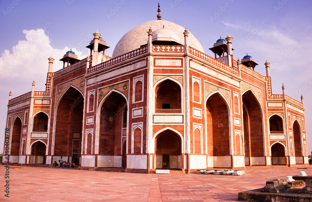 Close up of a humayun tomb entrance against a dramatic blue sky