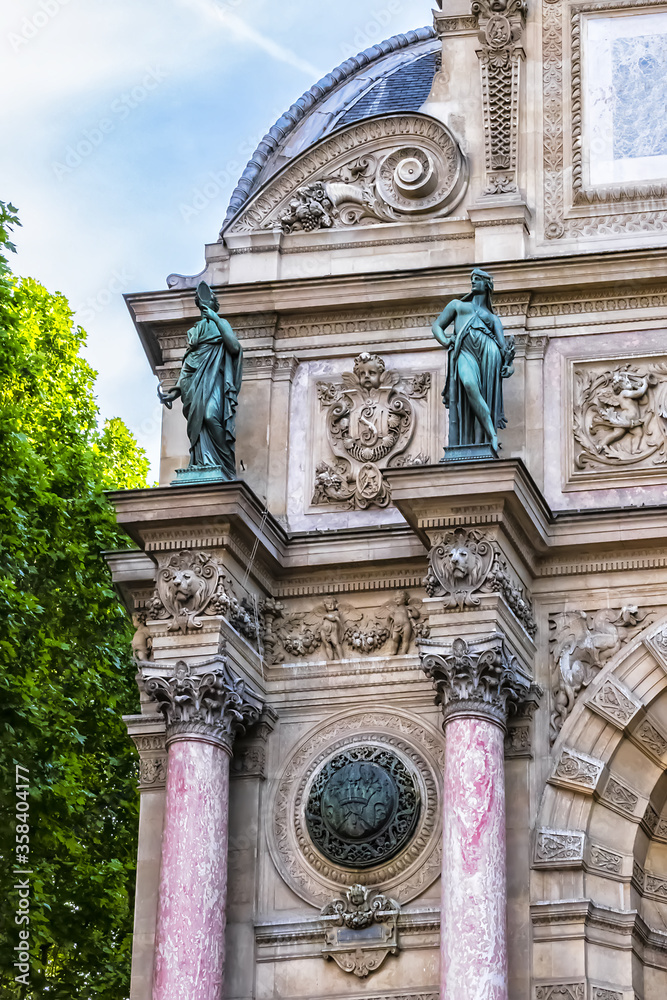 Obraz premium Sculpture of ancient Paris Fountain Saint-Michel at Place Saint-Michel. France. Fountain Saint-Michel constructed in 1858 - 1860 during French Second Empire. Paris, France. 