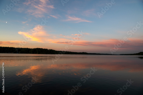 natural landscape with river forest and fantastic clouds in the sky