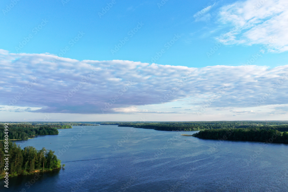 natural landscape with river forest and fantastic clouds in the sky natural landscape with river forest and fantastic clouds in the sky