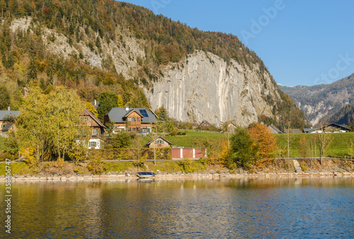 Lake Grundlsee in the early autumn morning. Village Grundlsee, region Salzkammergut, Liezen district of Styria, Austria, Europe. photo