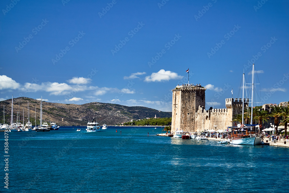 stone, medieval fortress and yacht harbor in the city of Trogir in Croatia.