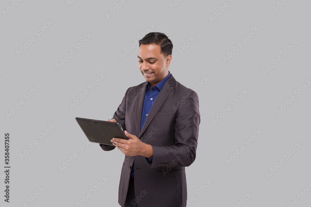Businessman Using Tablet Green Screen Isolated. Indian Business man with Tablet in Hands. Online Business Concept Businessman Using Tablet Green Screen Isolated. Indian Business man with Tablet in Hands. Online Business Concept