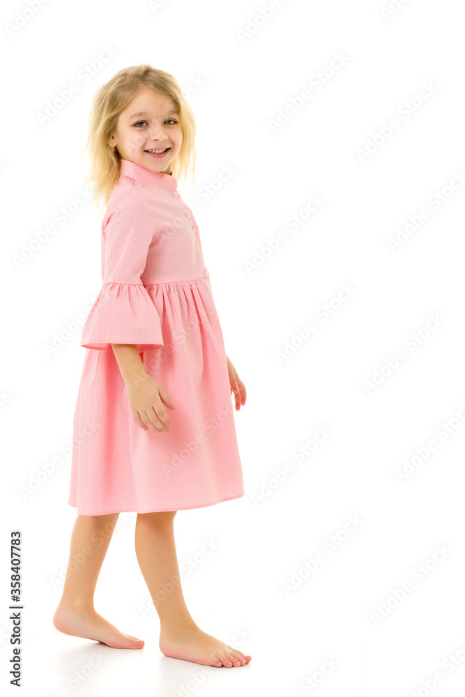 Full body length portrait of a beautiful girl in a dress