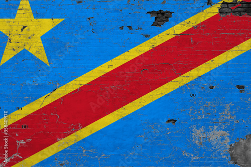 Congo flag on grunge scratched concrete surface. National vintage background. Retro wall concept.