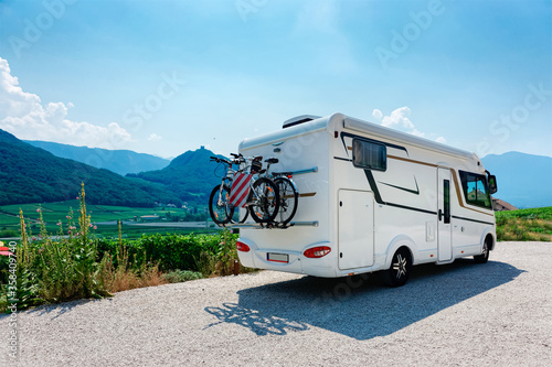 Vacation trip with RV caravan Car with bicycle in Italian South Tyrol