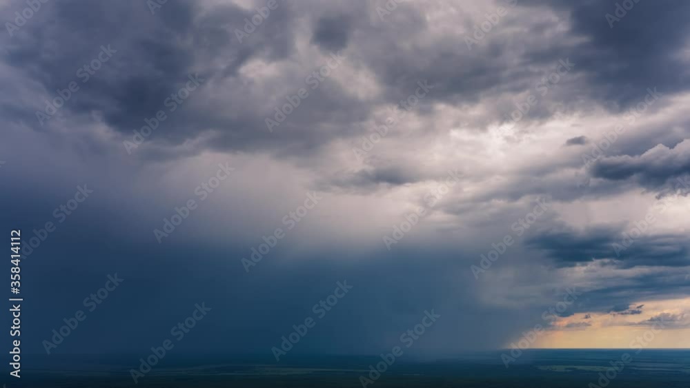 Stormy sky timelapse. Aerial timelapse of the sky with heavy rain cloud moving over the rural area Stormy sky timelapse. Aerial timelapse of the sky with heavy rain cloud moving over the rural area