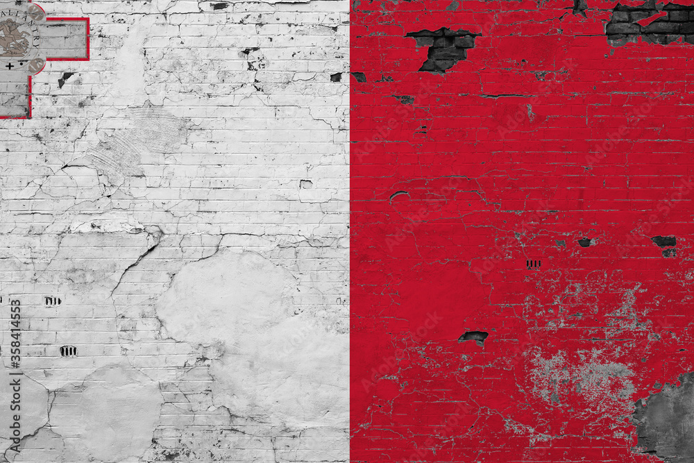 Malta flag on grunge scratched concrete surface. National vintage background. Retro wall concept.