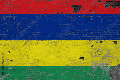 Mauritius flag on grunge scratched concrete surface. National vintage background. Retro wall concept.