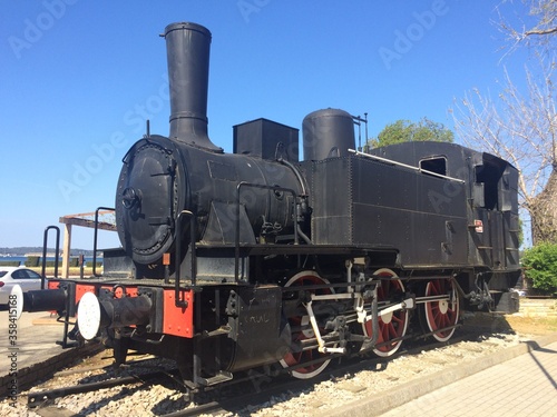 Old tender locomotive on a pedestal at the train station in Pula