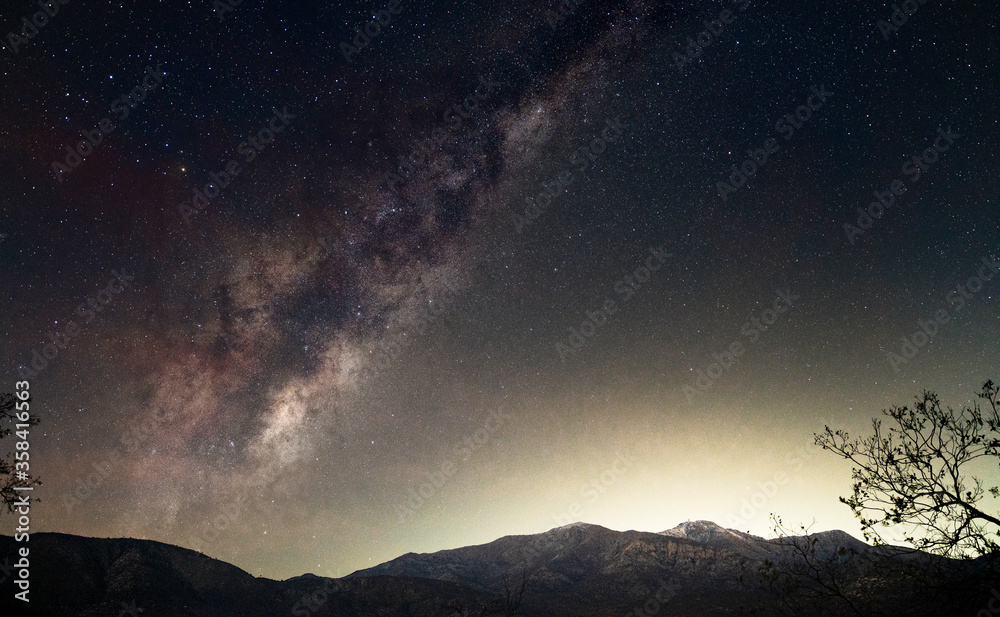 The milky way galaxy shining behind the Coastal mountain range of Central Chile.