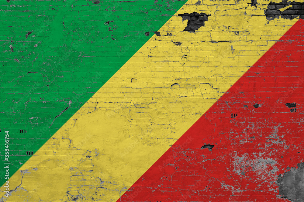 Republic Of The Congo flag on grunge scratched concrete surface. National vintage background. Retro wall concept.