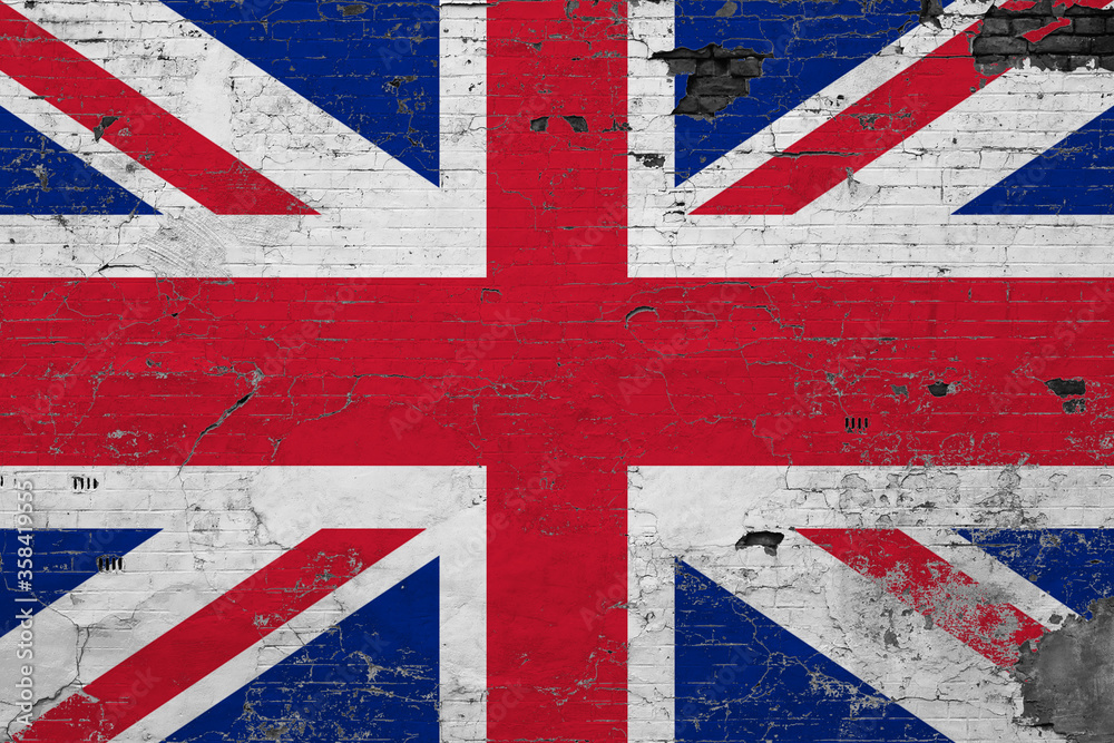 Fototapeta premium United Kingdom flag on grunge scratched concrete surface. National vintage background. Retro wall concept.