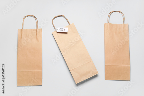 Paper shopping bags on light background