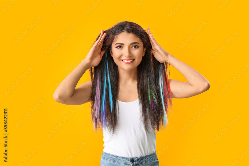 Fototapeta premium Beautiful young woman with unusual hair on color background