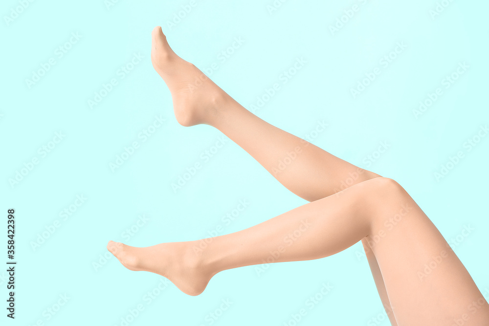 Beautiful young woman in tights on color background Beautiful young woman in tights on color background