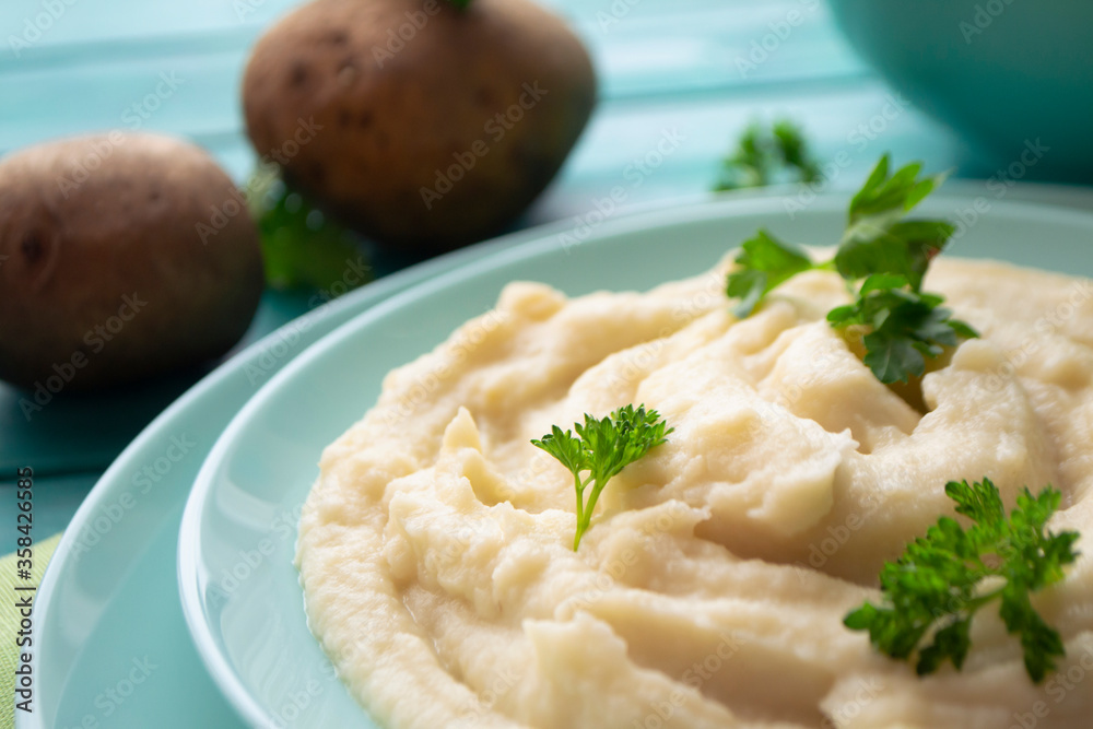 Rustic mashed potatoes with greens in bowl close up Rustic mashed potatoes with greens in bowl close up