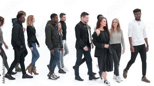 group of diverse young people walking one after the other