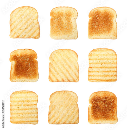 Set of toasted bread slices on white background, top view