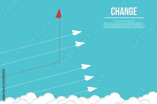 Think different. Think differently concept. Red airplane changing direction. New idea, change, trend, courage, creative solution, innovation and unique way concept.