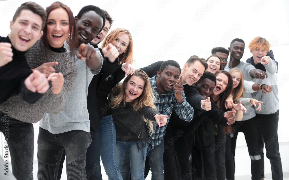 close-up . team of happy young people pointing at you