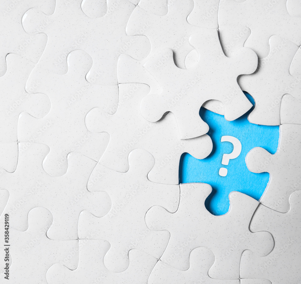White puzzle with missing piece and question mark on white background, top view White puzzle with missing piece and question mark on white background, top view