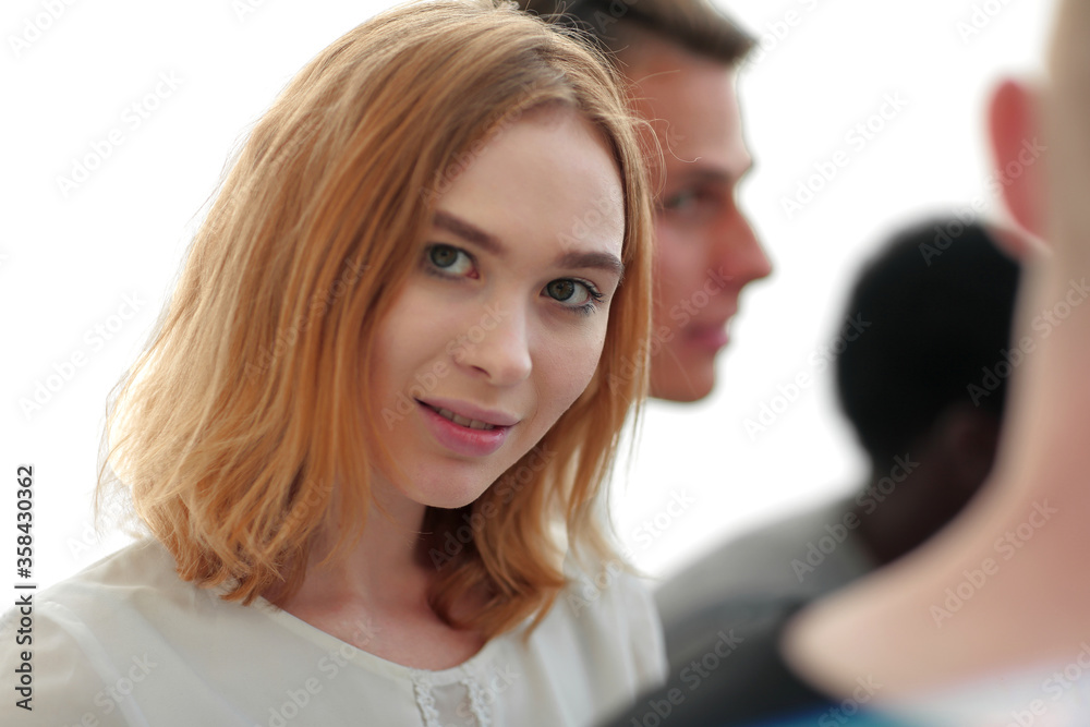 portrait of a beautiful young woman on the background of her friends portrait of a beautiful young woman on the background of her friends