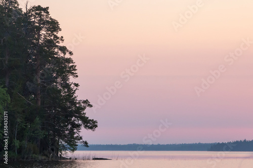 Russia  Karelia. White nights. Dawn on Lake Muezero. Trinity Island