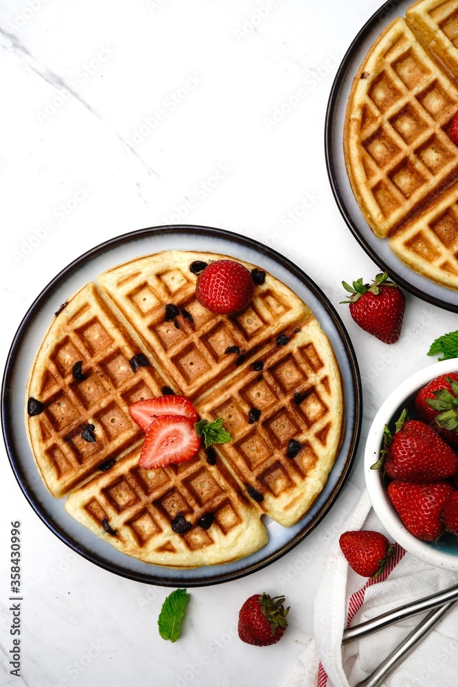Homemade Chocolate chip waffles with strawberries Homemade Chocolate chip waffles with strawberries