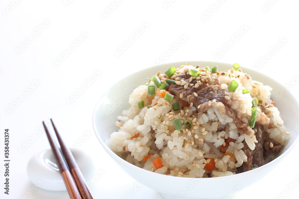 Japanese food, beff and carrot mixed rice with sesame and spring onion Japanese food, beff and carrot mixed rice with sesame and spring onion
