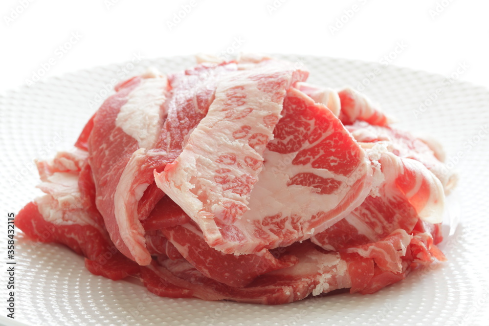 Freshness Japanese marble beef slices on white plate with copy space Freshness Japanese marble beef slices on white plate with copy space