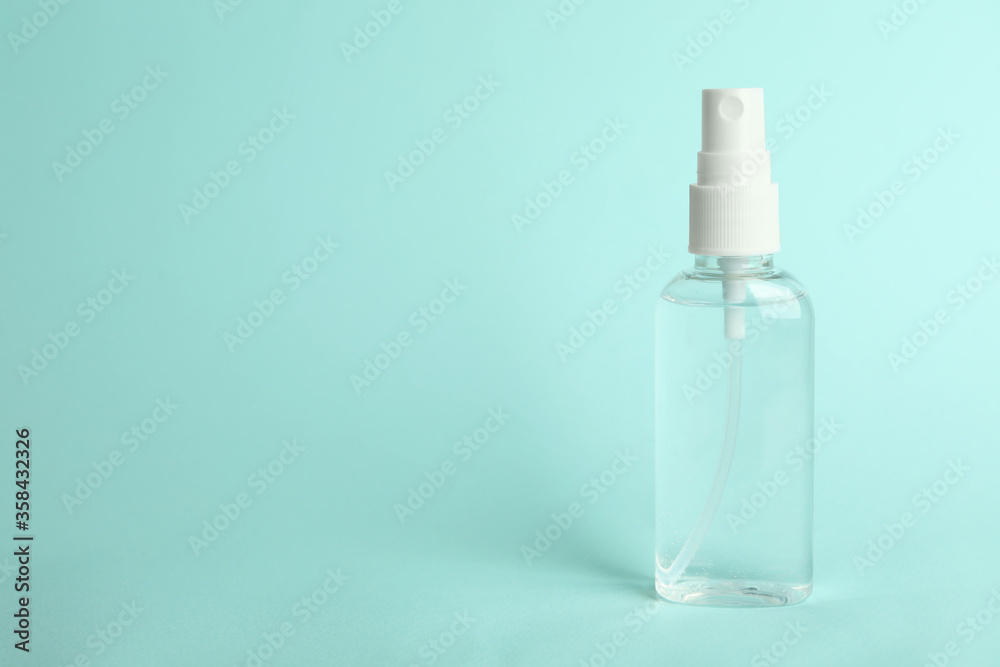 Antiseptic spray on light blue background. Space for text Antiseptic spray on light blue background. Space for text